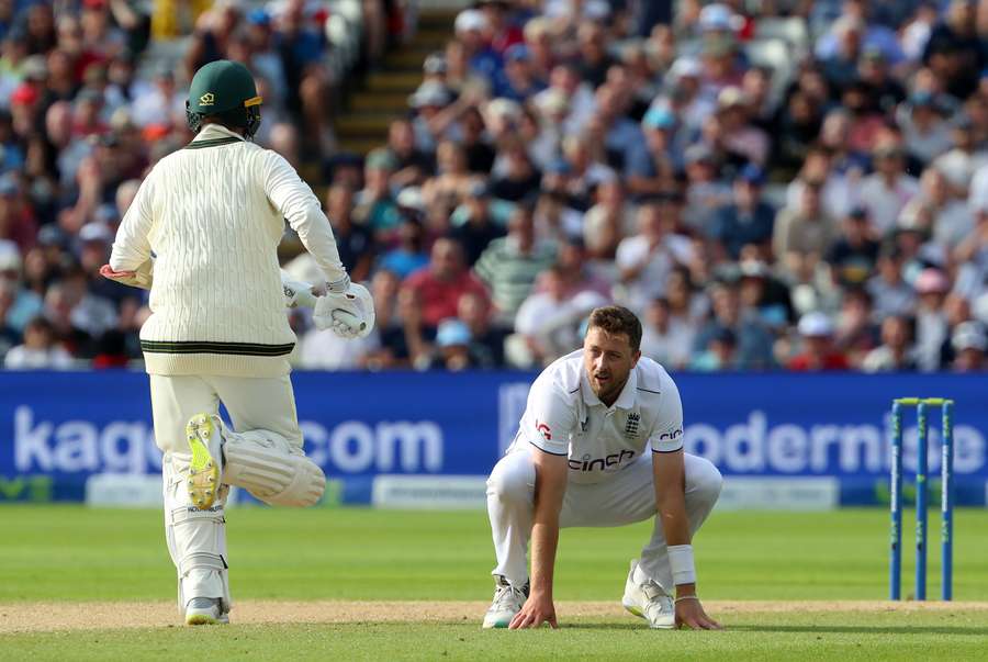 England's Ollie Robinson reacts as Australia's Nathan Lyon adds runs