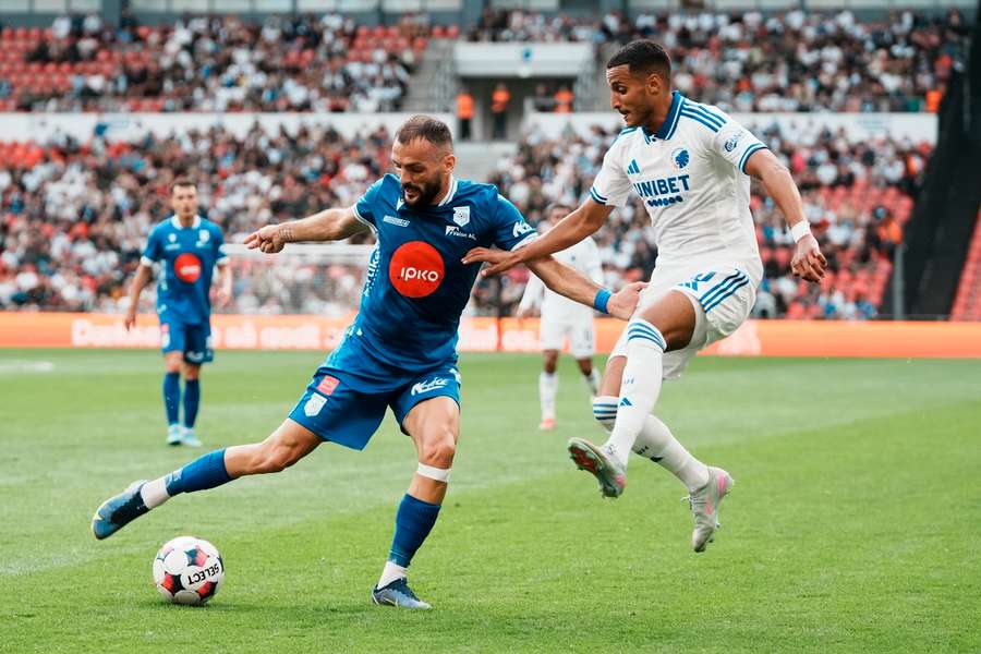 FC Drita's Besnik Krasniqi tussle with FC Copenhagen's Elias Achouri for the ball