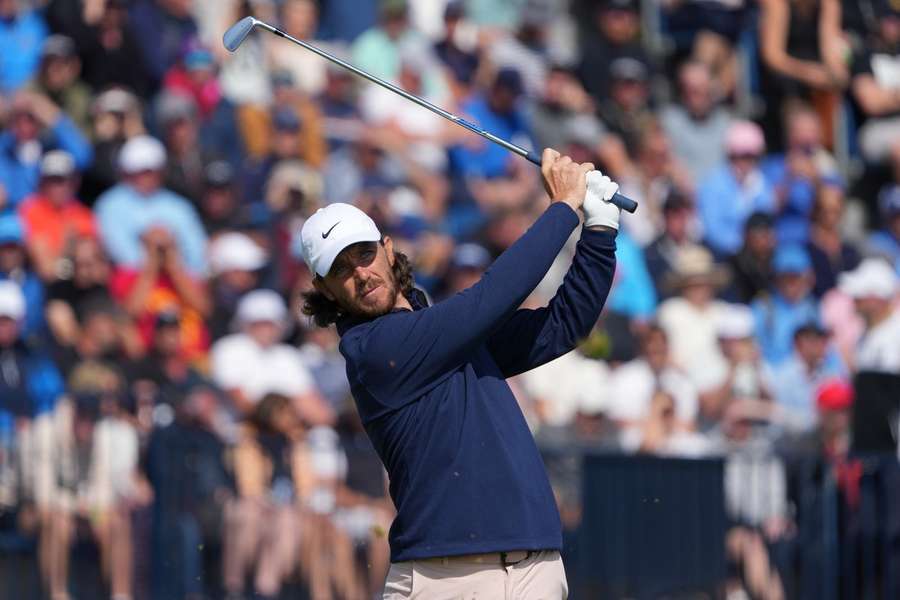 Tommy Fleetwood plays his shot from the fourth tee