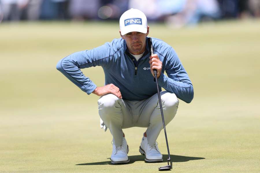 Alex Smalley lines up a putt