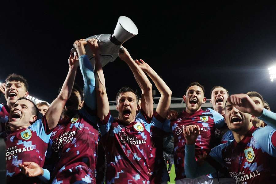 Burnley players celebrate with the Championship trophy