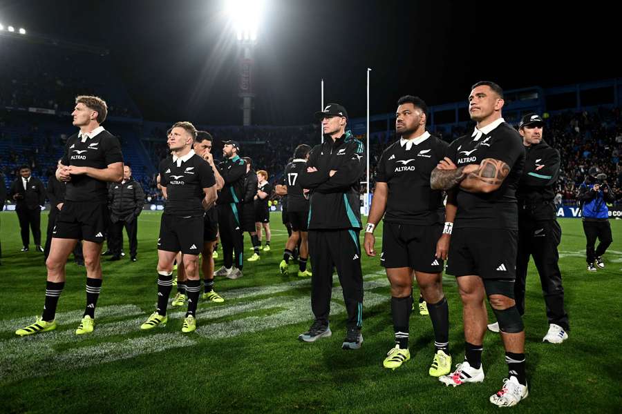 New Zealand's players watch on as Argentina celebrate