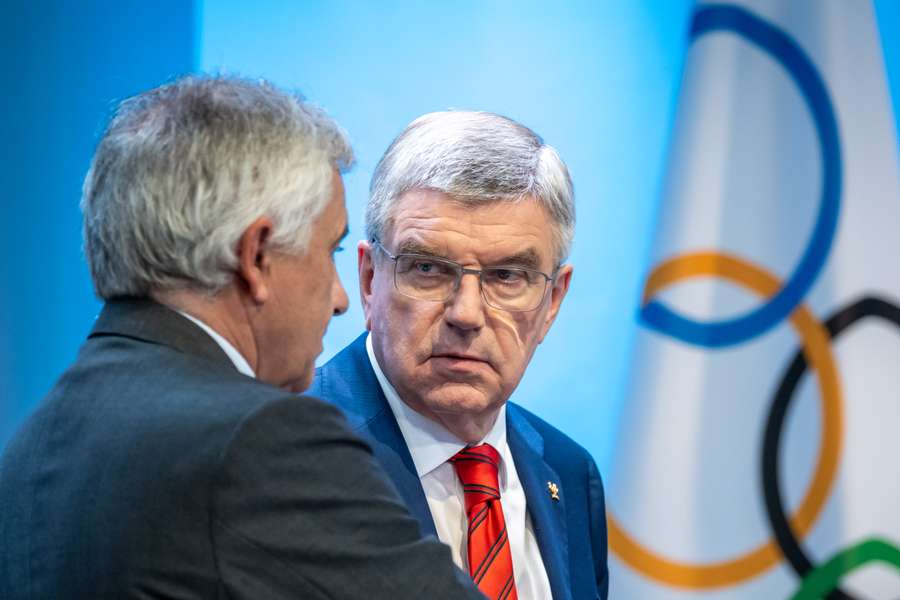 International Olympic Committee executive (IOC) President Thomas Bach (R) speaks with Vice-president Juan Antonio Samaranch Jr. in Lausanne