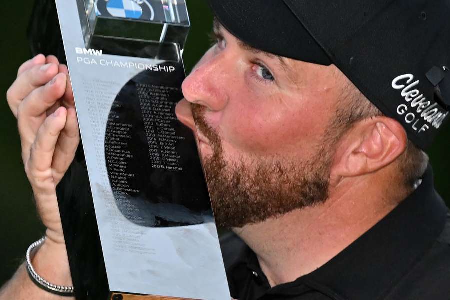 Ireland's Shane Lowry kisses the trophy after his victory on the final day of the BMW PGA Championship at Wentworth Golf Club