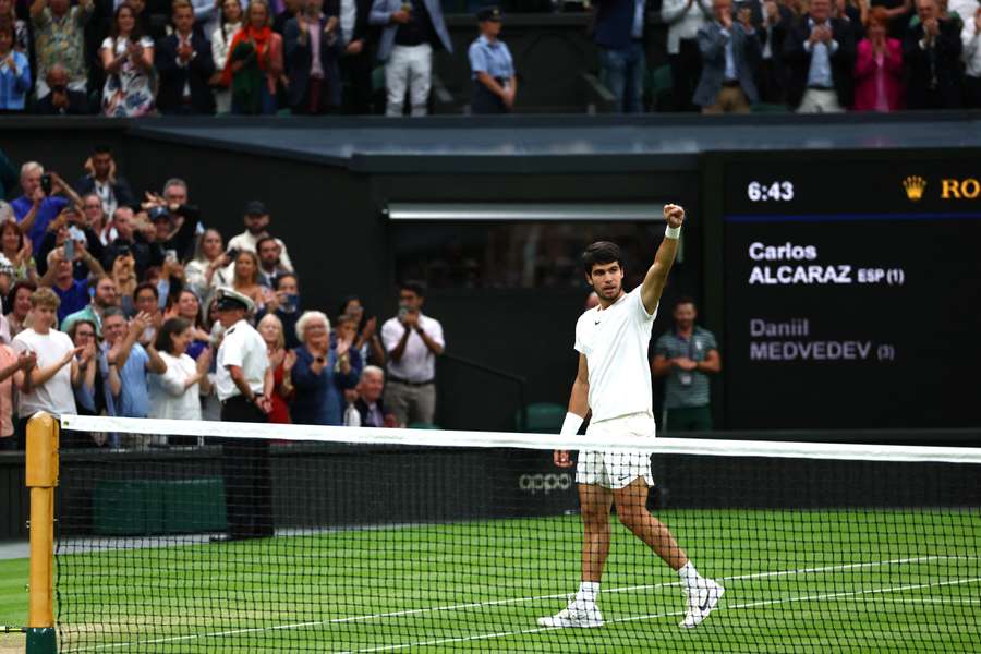 Carlos Alcaraz salutes the crowd on Centre Court after beating Daniil Medvedev