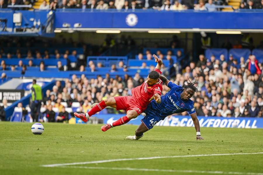 Chelsea's Romeo Lavia stops Liverpool's Mohamed Salah in his tracks