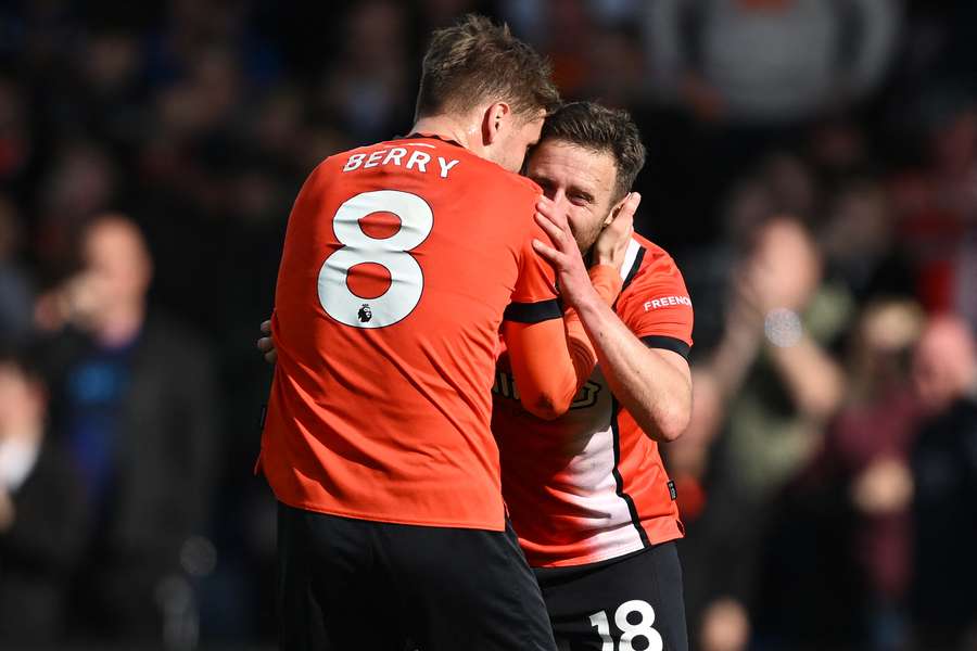 ordan Clark (R) celebrates with Luton Town's English midfielder #08 Luke Berry (L) after scoring their first goal 