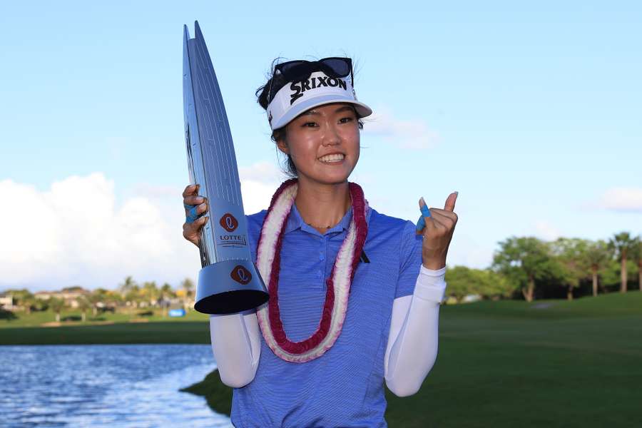 Grace Kim poses with the Lotte Championship trophy after her win in Ewa Beach, Hawaii