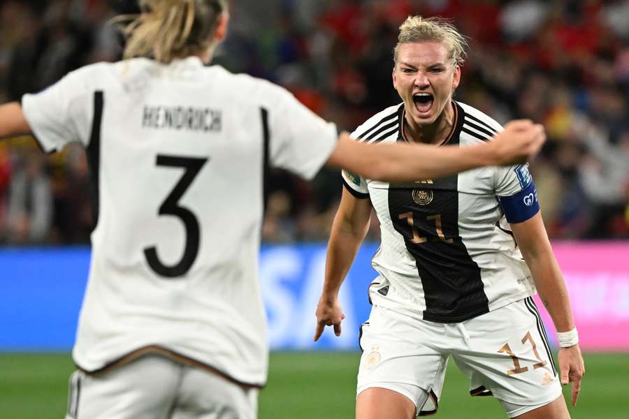 Germany forward Alexandra Popp (R) celebrates scoring her team's first goal