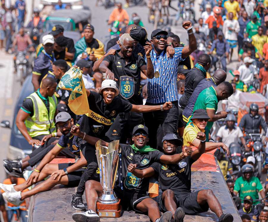 Yanga players with the trophy