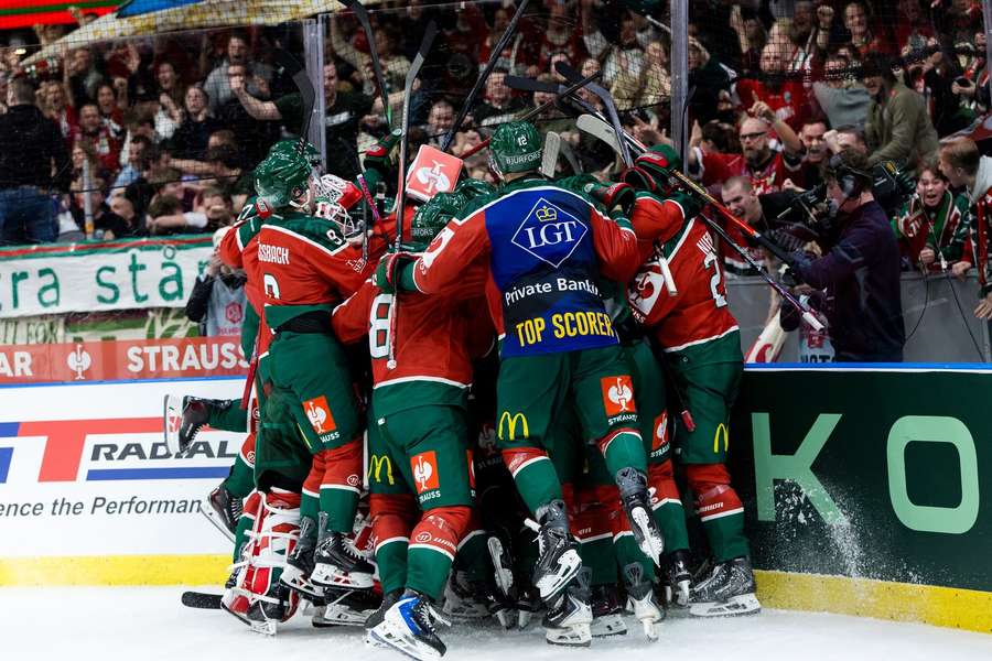 Frolunda players wildly celebrate Innala's winner Frolunda players wildly celebrate Innala's winner