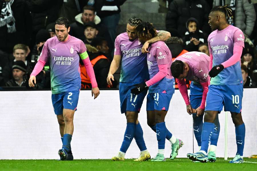 AC Milan celebrate their second goal against Newcastle