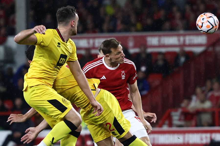 Wood bravely latches onto a header