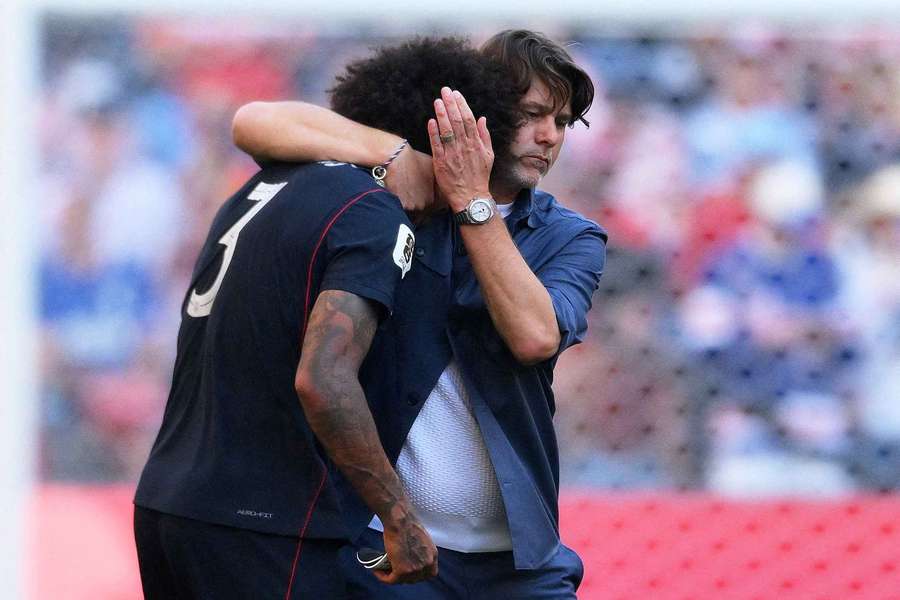 Mauricio Pochettino consoles Chris Richards following the USA's exit from the World Cup Mauricio Pochettino consoles Chris Richards following the USA's exit from the World Cup