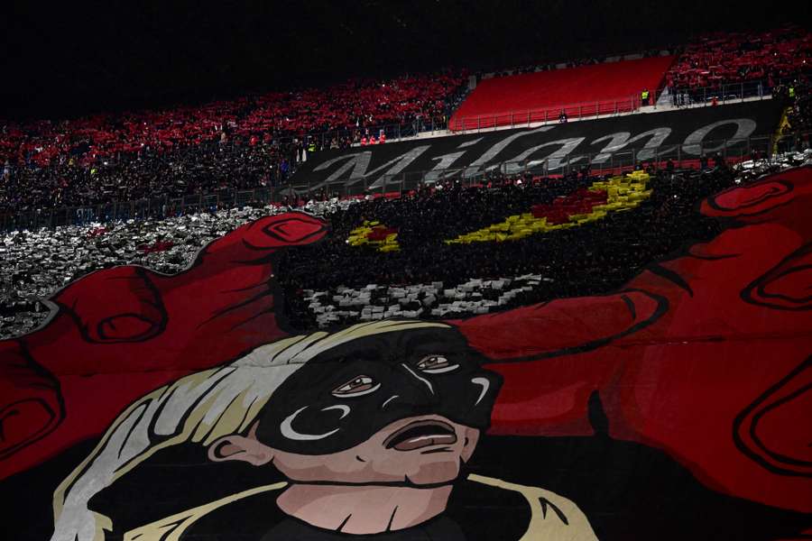 AC Milan fans unfurl a giant tifo prior to the UEFA Champions League quarter-finals first leg football match between AC Milan and SSC Napoli on April 12