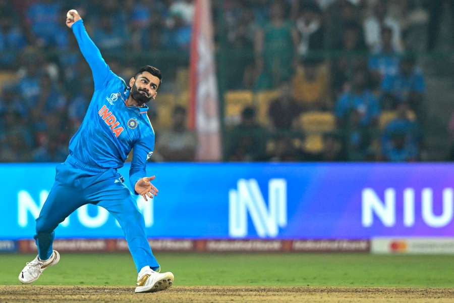 India's Virat Kohli bowls during the 2023 ICC Men's Cricket World Cup one-day international (ODI) match between India and Netherlands