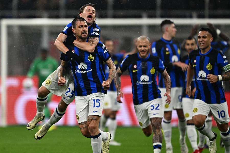 Francesco Acerbi is mobbed by his teammates after scoring the opening goal