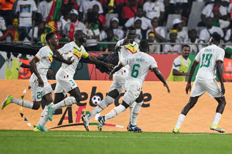 Senegal celebrate after scoring against Guinea