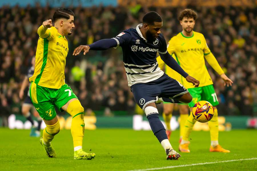 Borja Sainz of Norwich City puts pressure on Japhet Tanganga of Millwall