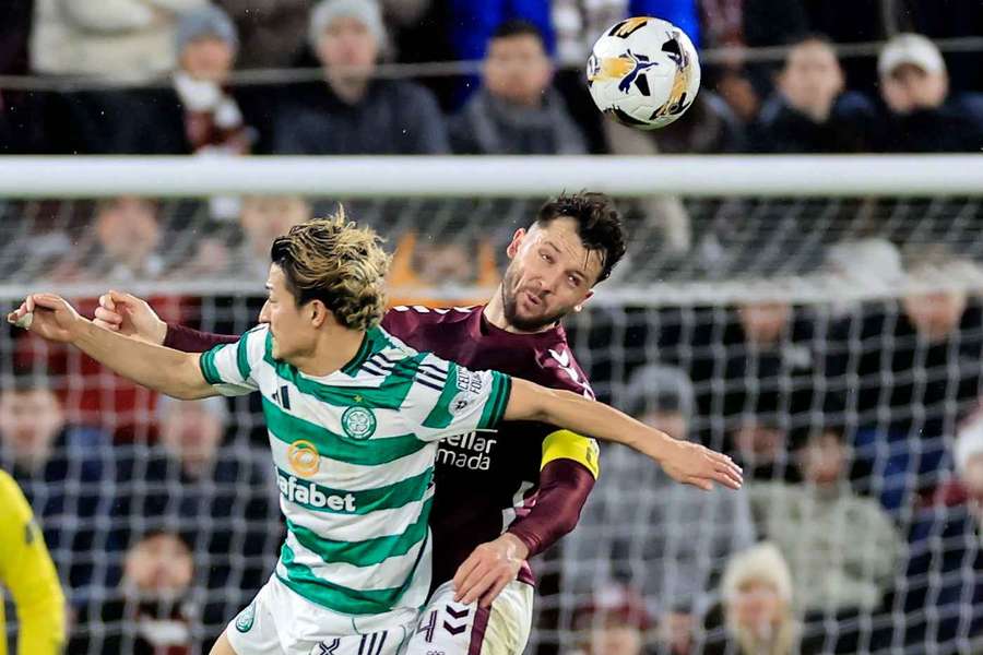 Hearts held by 10-man Celtic as Rangers close in
