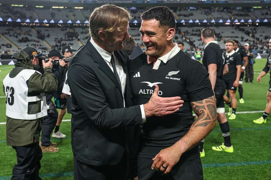All Blacks head coach Scott Robertson celebrates their Bledisloe Cup victory with Codie Taylor last weekend.