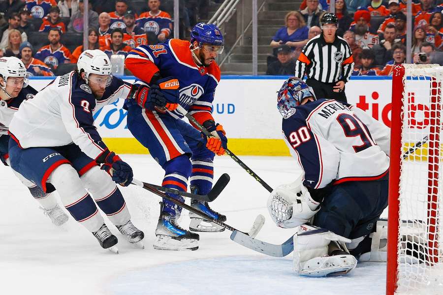 Columbus Blue Jackets goaltender Elvis Merzlikins makes a save on Edmonton Oilers forward Evander Kane