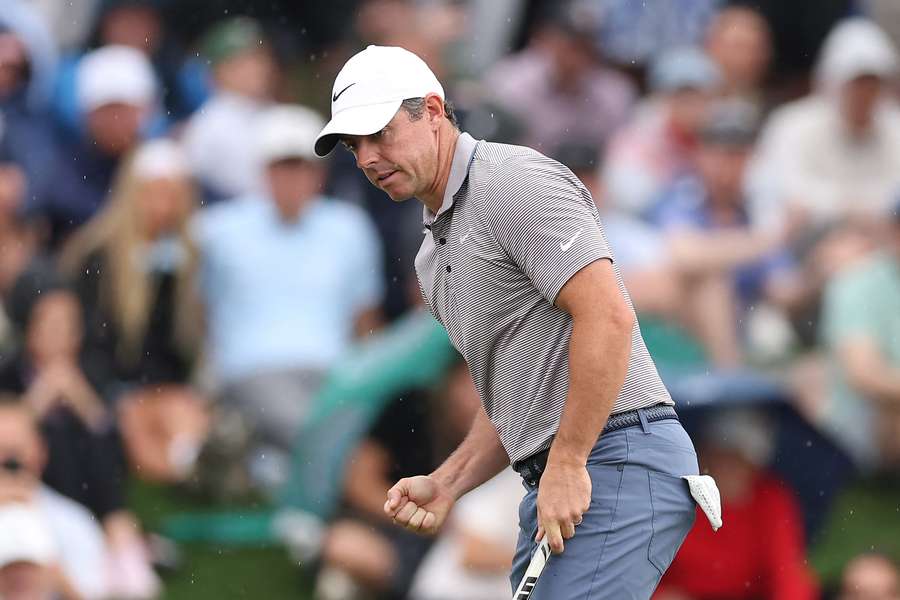 Rory McIlroy celebrates after sinking a putt on the 11th green