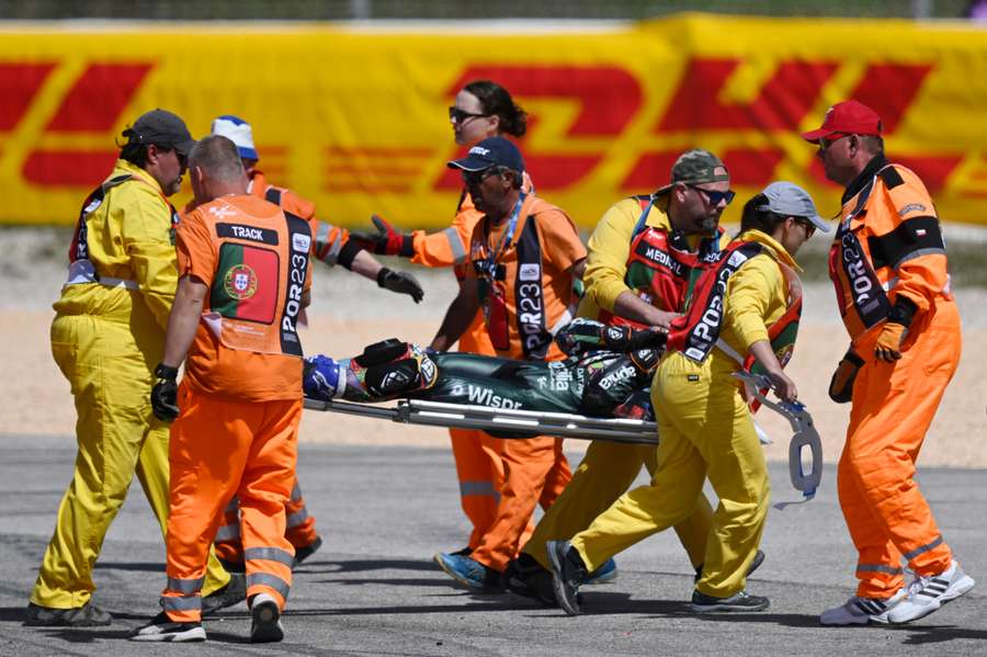 Oliveira is stretchered off during the Portuguese Grand Prix 