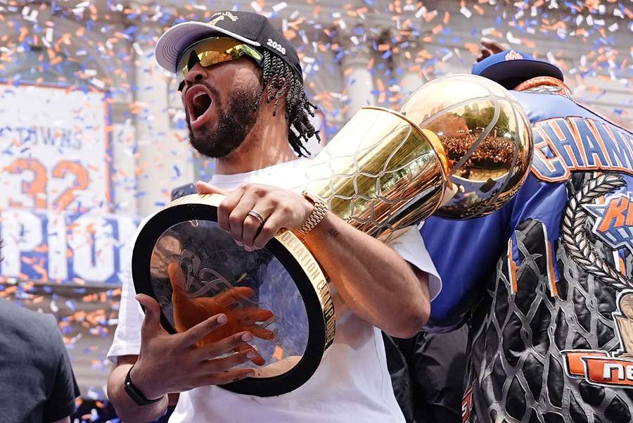 Jalen Brunson of the New York Knicks celebrates with the Larry O'Brien Championship Trophy Jalen Brunson of the New York Knicks celebrates with the Larry O'Brien Championship Trophy