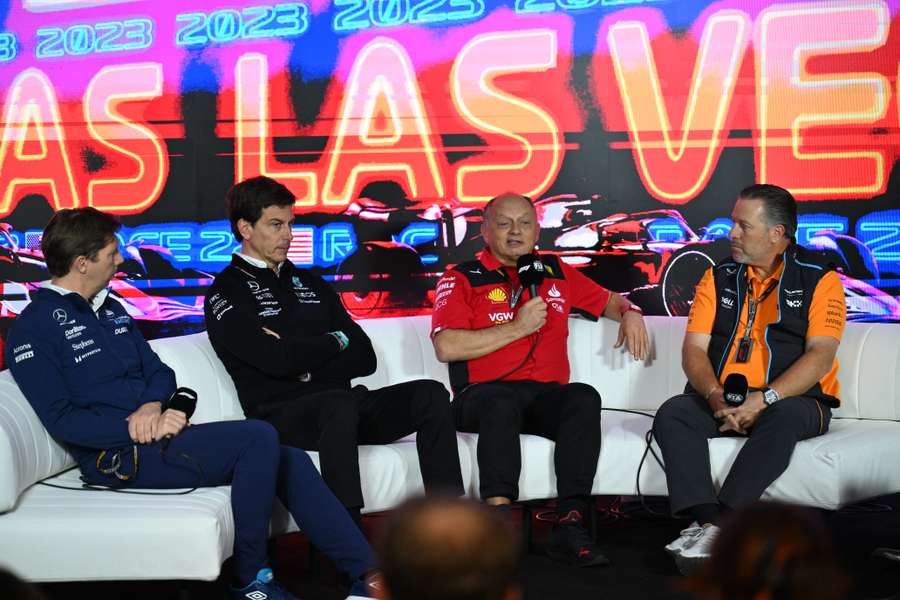 Mercedes' Toto Wolff and Ferrari's Frederic Vasseur (C) attend a press conference at the Las Vegas Formula 1 Grand Prix