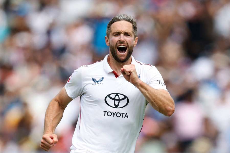 Chris Woakes celebrates after taking the wicket of India's Nitish Kumar