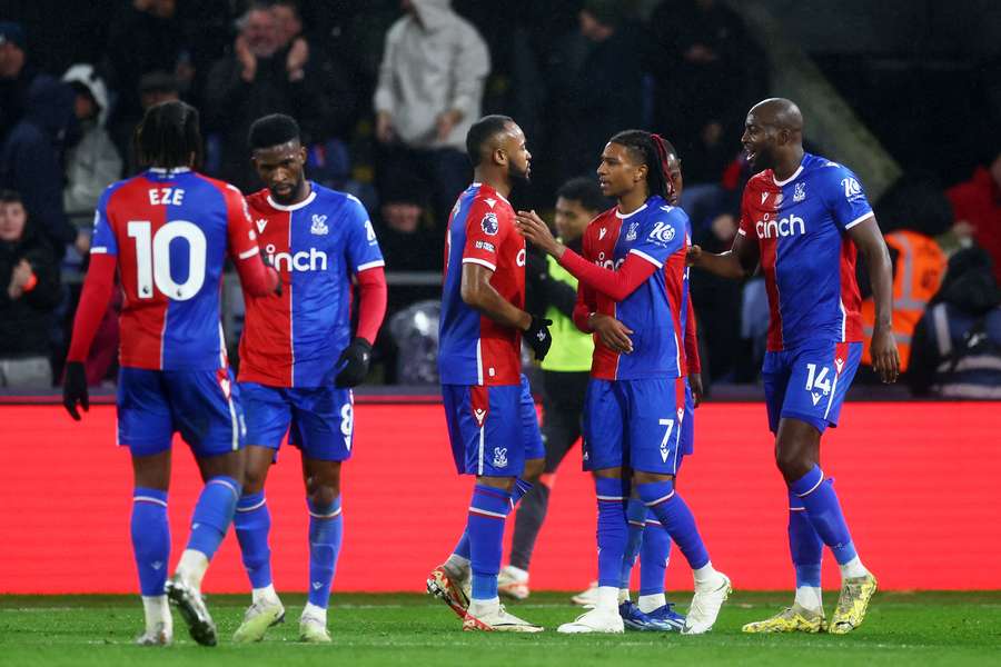 Michael Olise celebrates with teammates after giving Crystal Palace a 3-1 lead