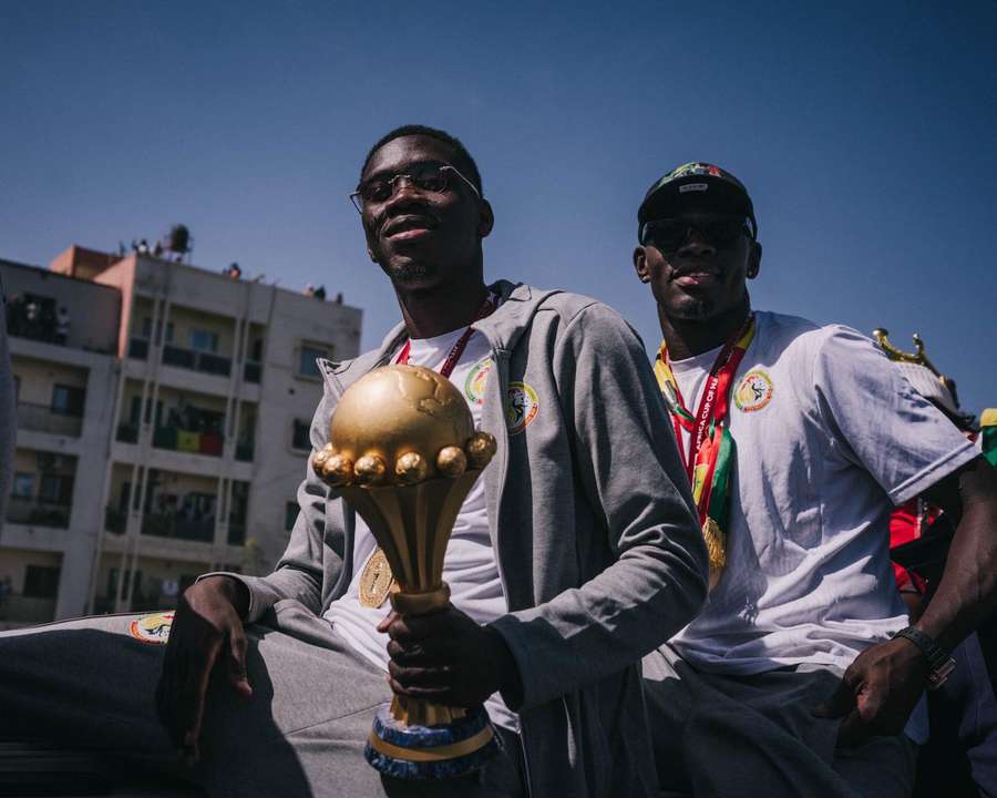 Senegal players celebrate AFCON success after defeating Morocco 1-0 in the final.