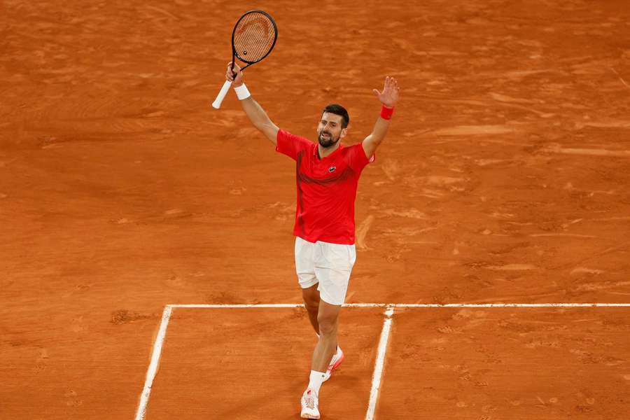 Novak Djokovic celebrates after winning his quarter-final match against Alexander Zverev
