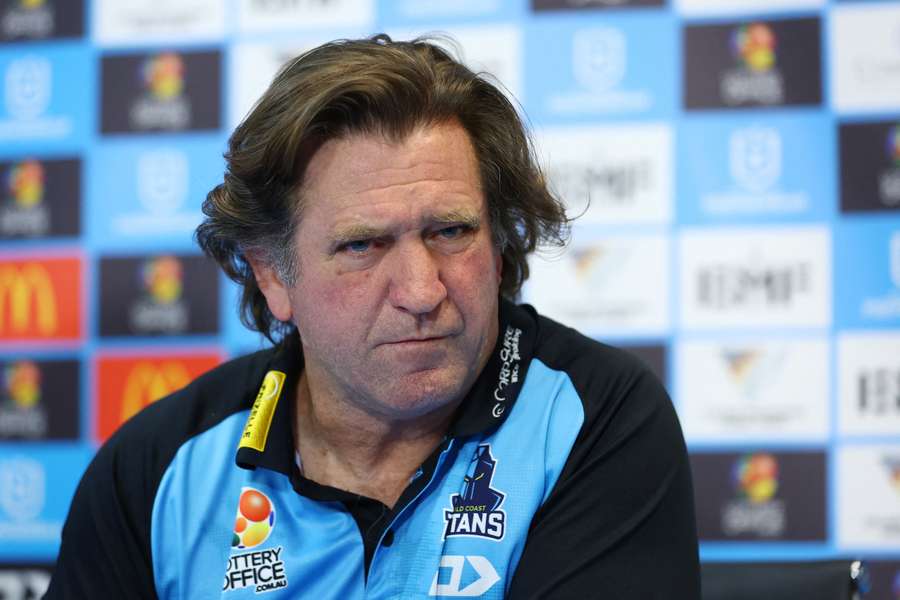 Des Hasler addresses the media at a post-match press conference. 