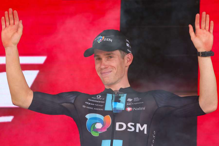 Team DSM's Italian rider Alberto Dainese celebrates on the podium after winning the seventeenth stage of the Giro d'Italia 2023 cycling race