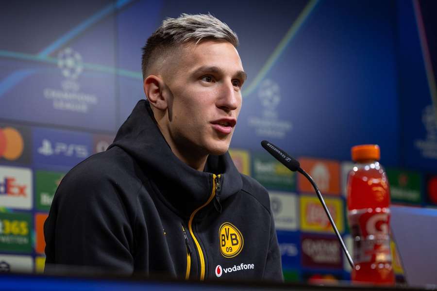 Nico Schlotterbeck speaks during a press conference
