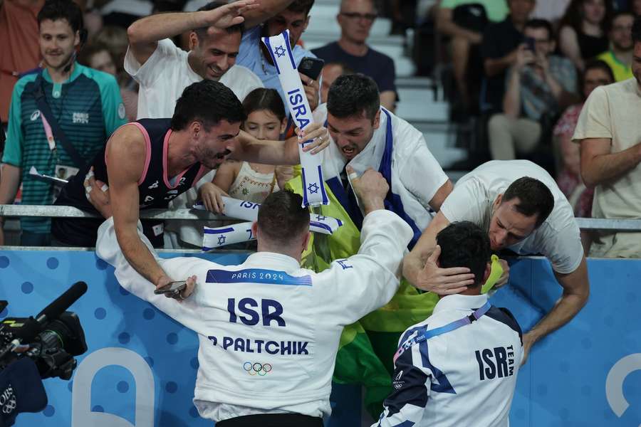 Peter Paltchik of Israel celebrates winning against Daniel Eich of Switzerland fight during the Men -100kg bronze medal bout