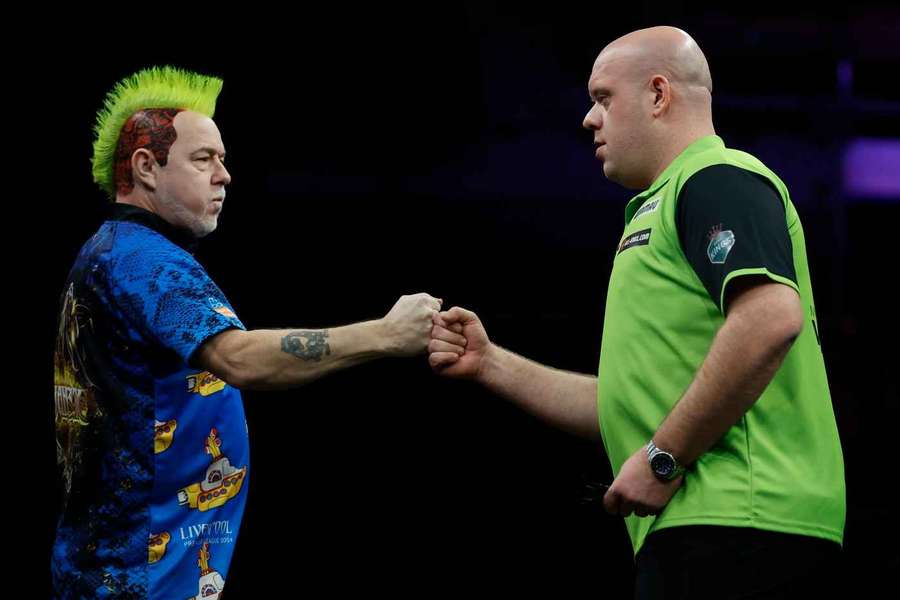 Peter Wright and Michael van Gerwen during the 2024 Premier League