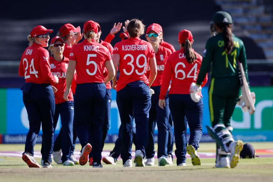 England's Nat Sciver-Brunt (C) celebrates with teammates