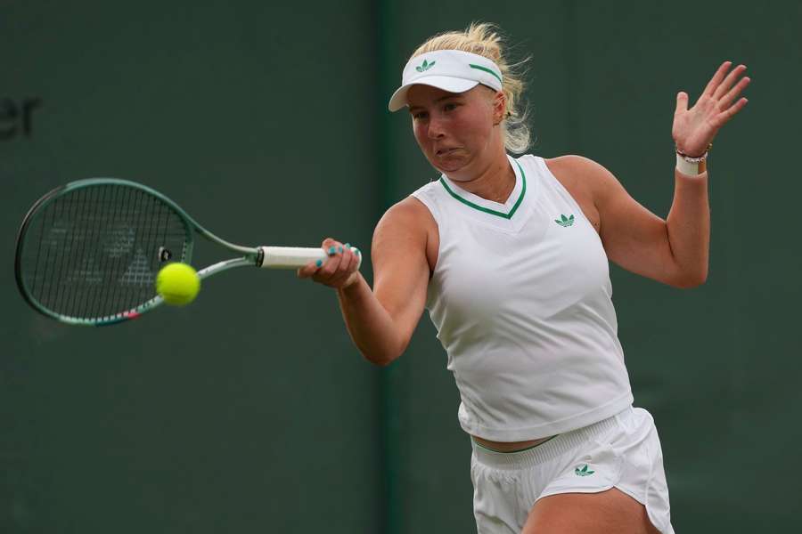 Tauson in action against Kalinskaya
