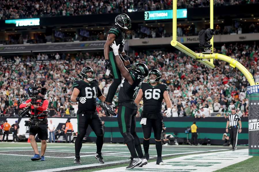 The Jets celebrate a touchdown