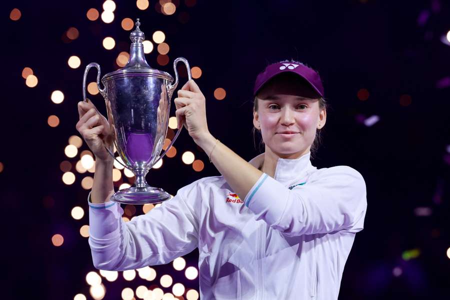 Rybakina celebrates with the trophy