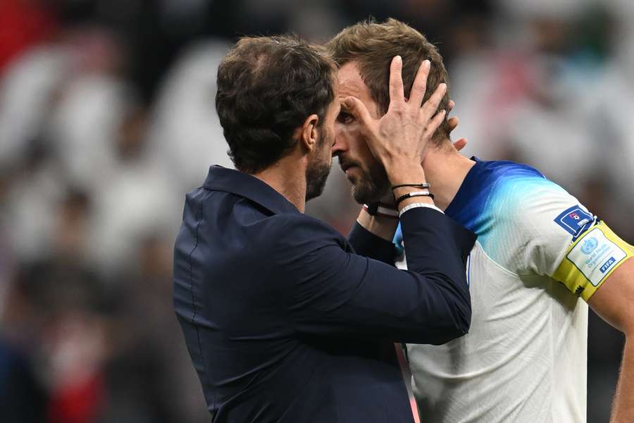 Gareth Southgate consoles captain Harry Kane after his penalty miss against France in Qatar
