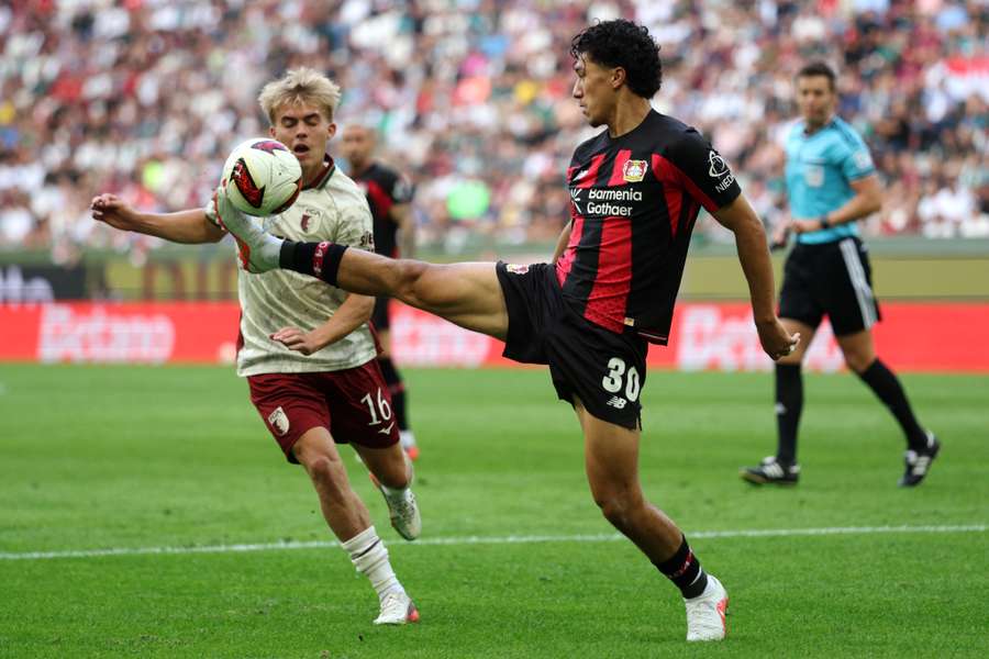 Ibrahim Maza (right) battles for the ball with Hennes Behrens Ibrahim Maza (right) battles for the ball with Hennes Behrens