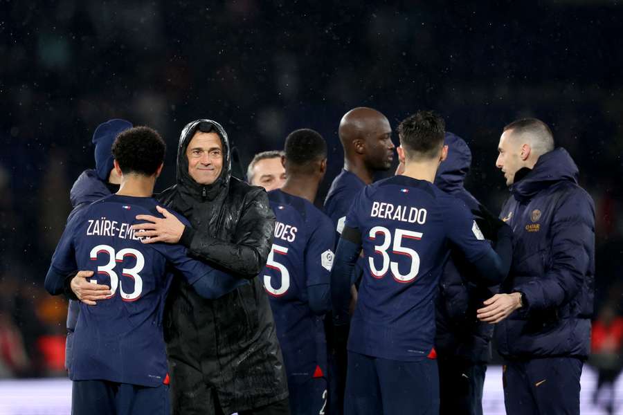 Paris Saint-Germain's Spanish headcoach Luis Enrique (2nd L) celebrates