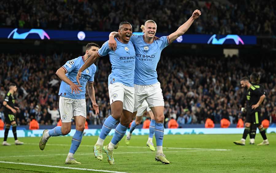 Manuel Akanji celebrates with Erling Haaland as City dumped Madrid out in the semis