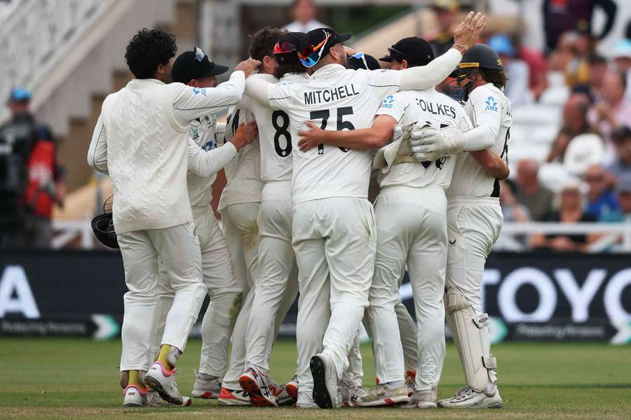 New Zealand players celebrate after taking the wicket of England's Jamie Smith to win the Test, winning the series 2-1 