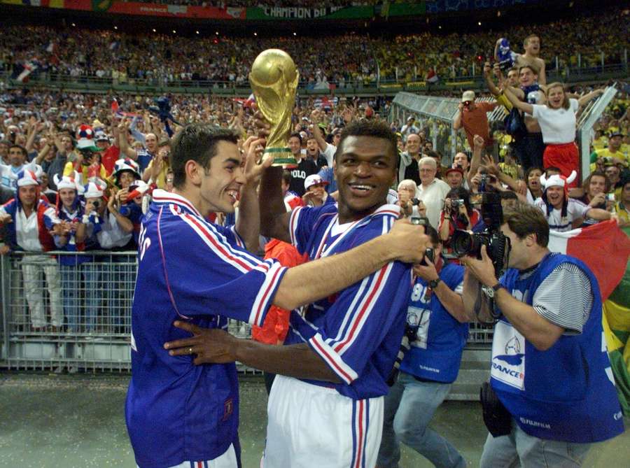 Desailly (R) with the World Cup in 1998 Desailly (R) with the World Cup in 1998