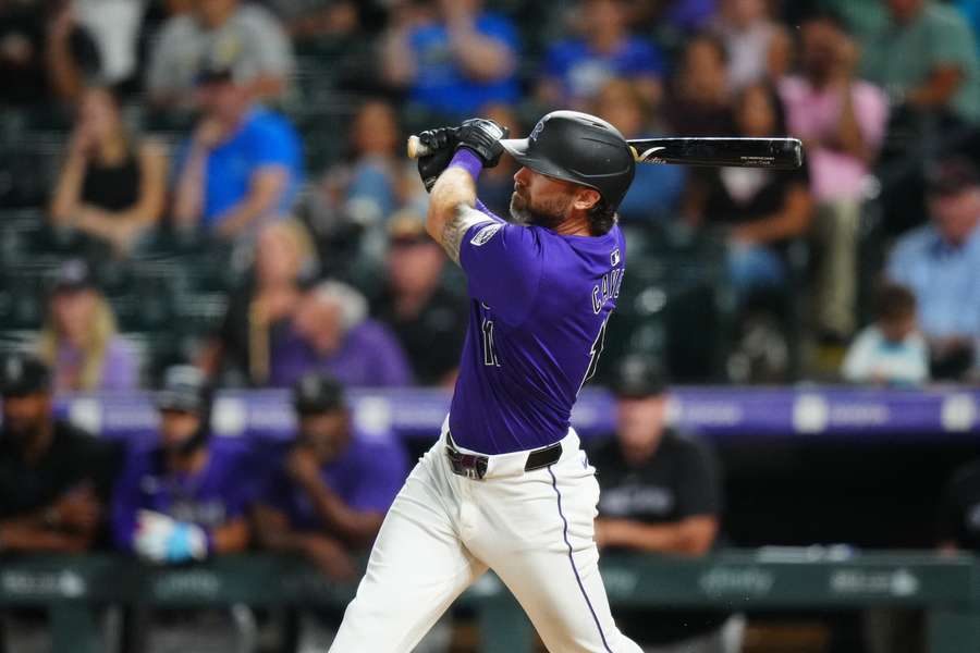 Colorado Rockies outfielder Jake Cave hits a walk off single in the tenth inning against the Milwaukee Brewers